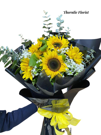 Golden Glow Bouquet of bright yellow sunflowers and white baby's breath by Thornlie Florist