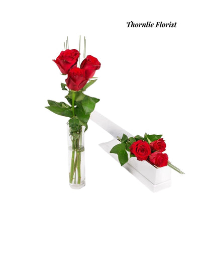 Endless Love Roses: Three red roses in a glass vase and a decorative white box.