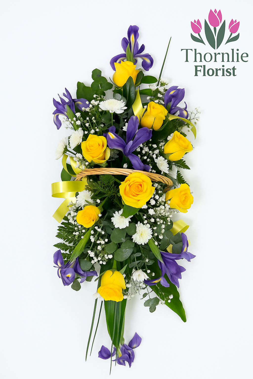 Golden Farewell funeral flower arrangement with yellow roses and purple irises in a basket.