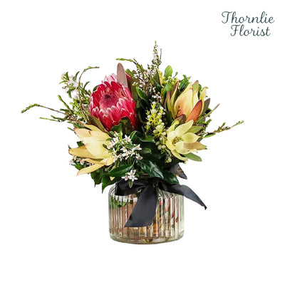 Florist Choice Natives In Jar featuring a red protea and yellow wildflowers by Thornlie Florist