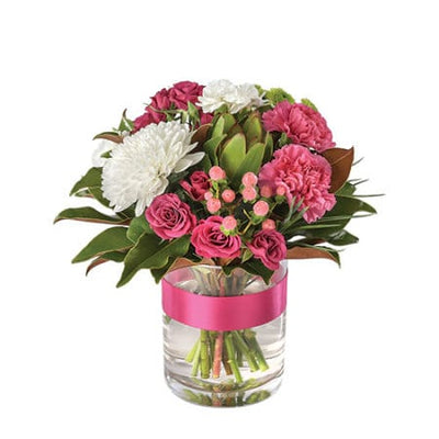 Pink Lady Bouquet with pink carnations and white chrysanthemums in a glass vase by Thornlie Flourist