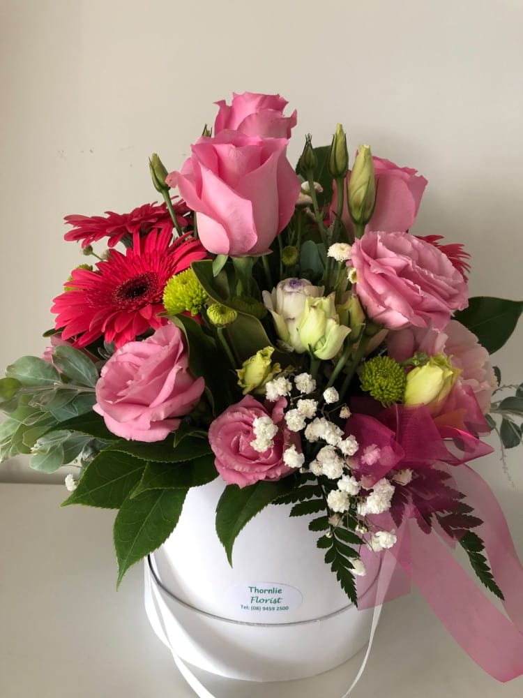 Pretty pink flower arrangement by Thornlie Flourist in a white gift box